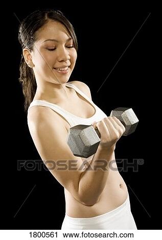 Woman holding barbell View Large Photo Image Stock Image - Woman holding barbell. Fotosearch