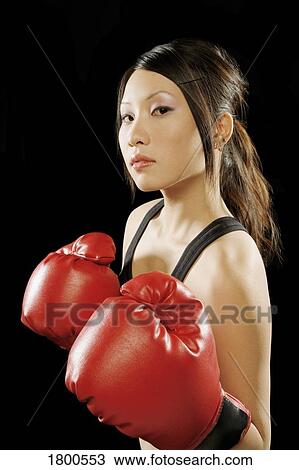Stock Image - Woman In Boxing Gloves. Fotosearch