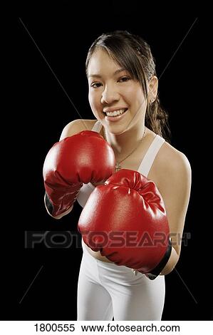 Stock Photography - Woman in boxing gloves. Fotosearch