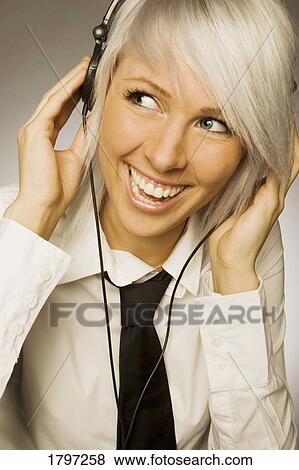 Stock Photo - Woman listening to music. Fotosearch