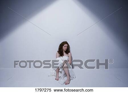 Woman sitting alone View Large Photo Image Stock Photography - Woman sitting alone. Fotosearch