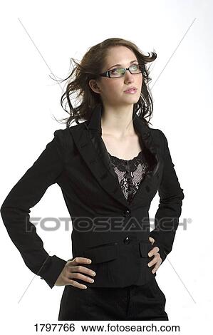 Stock Photograph - Woman standing with her hands on her hips. Fotosearch