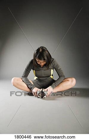 Woman stretching View Large Photo Image Stock Photograph - Woman stretching . Fotosearch