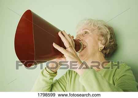 Stock Photo - Woman talking into a bullhorn. Fotosearch