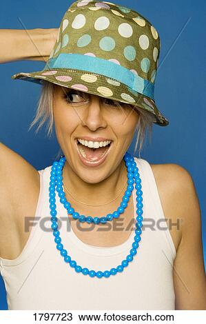 Woman wearing a hat and necklace Stock Image | 1797723 | Fotosearch