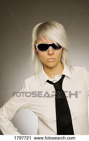 Woman wearing sunglasses View Large Photo Image Stock Image - Woman wearing sunglasses. Fotosearch