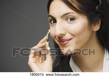 Woman with headset View Large Photo Image Stock Photography - Woman with headset. Fotosearch