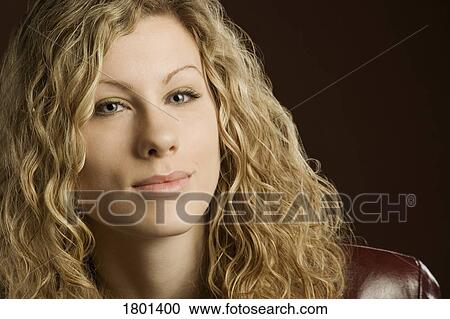 Woman with long blond curly hair View Large Photo Image Stock Image - Woman with long blond curly hair. Fotosearch