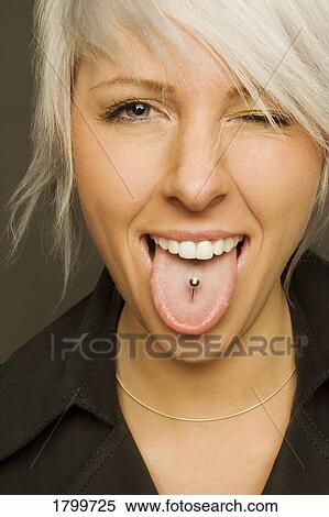 Woman with tongue piercing View Large Photo Image Stock Photography - Woman with tongue piercing. Fotosearch