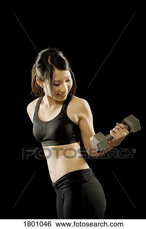 Stock Photograph - Woman working out. Fotosearch