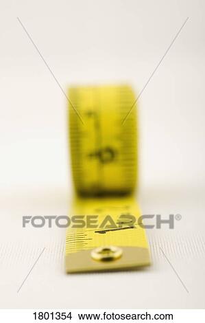 Picture - Yellow tape measure. Fotosearch