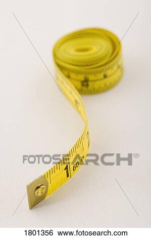 Stock Photograph - Yellow tape measure. Fotosearch