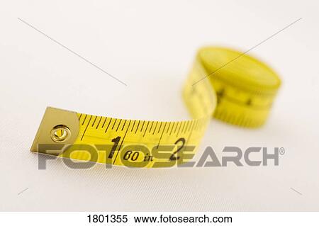 Stock Photography - Yellow tape measure. Fotosearch