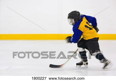 Stock Photo - Young Hockey Player . Fotosearch