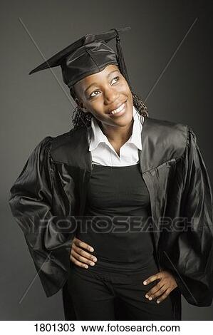 Young woman in graduation cap and gown View Large Photo Image Stock Image - Young woman in graduation cap and gown. Fotosearch