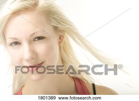Stock Photo - Young woman with blonde hair. Fotosearch