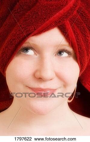 Young woman with hair wrapped in red towel View Large Photo Image Stock Image - Young woman with hair wrapped in red towel. Fotosearch