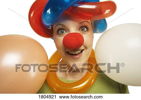 Stock Image - A clown with balloons. Fotosearch