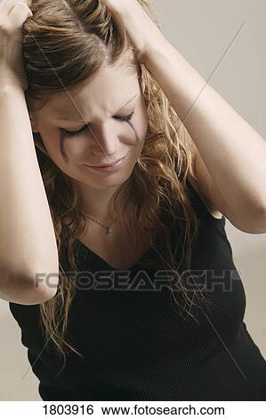 A depressed woman tearing her hair View Large Photo Image Stock Photograph - A depressed woman tearing her hair. Fotosearch