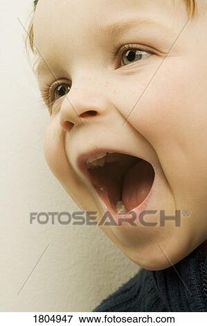 Stock Photo - A happy young boy. Fotosearch