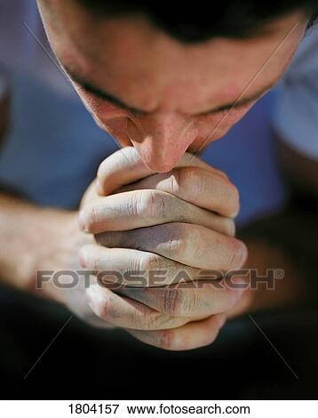 A man praying View Large Photo Image Stock Photo - A man praying. Fotosearch