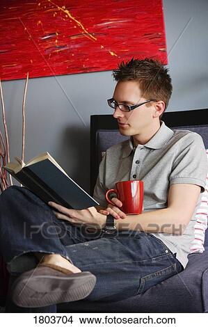 Picture - A man reading book. Fotosearch