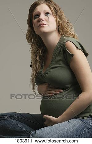 A pensive pregnant woman View Large Photo Image Stock Image - A pensive pregnant woman. Fotosearch