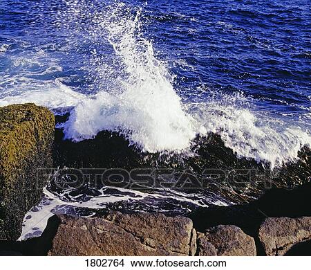 A wave splashing on the shore View Large Photo Image Picture - A wave splashing on the shore. Fotosearch