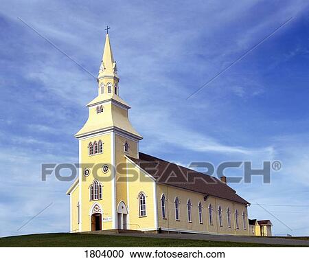 Stock Image - A yellow church with steeple. Fotosearch