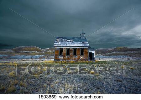 Stock Photo - Abandoned church in the field with storm clouds. Fotosearch