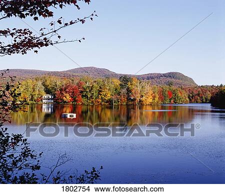 Autumn colours reflected in lake View Large Photo Image Picture - Autumn colours reflected in lake. Fotosearch