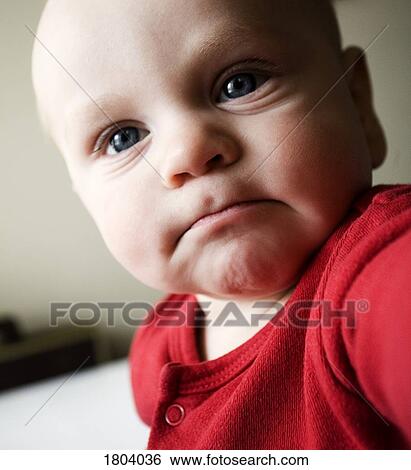 Stock Photograph - Baby making faces. Fotosearch