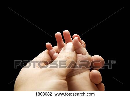 Baby's hand being held in adult's hand View Large Photo Image Stock Image - Baby's hand being held in adult's hand. Fotosearch