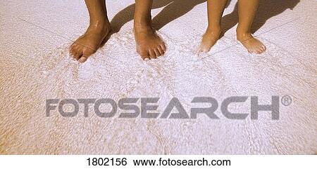 Barefoot on the beach View Large Photo Image Stock Photograph - Barefoot on the beach . Fotosearch
