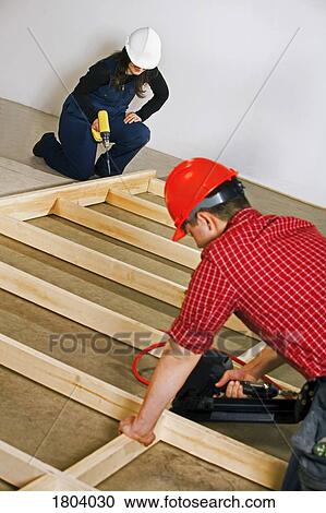 Carpenters working with power tools View Large Photo Image Stock Image - Carpenters working with power tools. Fotosearch
