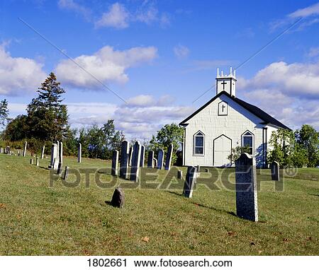 Stock Image - Church and cemetery. Fotosearch