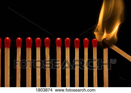 Picture - Closeup view of burning match sticks. Fotosearch