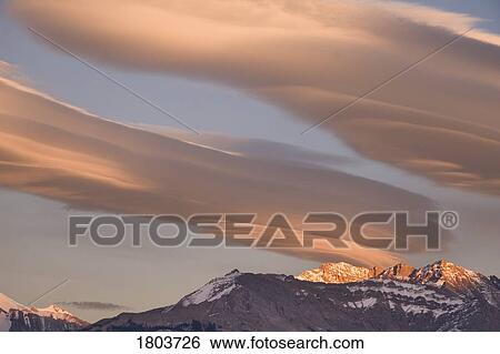 Clouds at sunset above mountain peaks, Kootenay Plains, Alberta, Canada View Large Photo Image Stock Photograph - Clouds at sunset above mountain peaks, Kootenay Plains, Alberta, Canada . Fotosearch