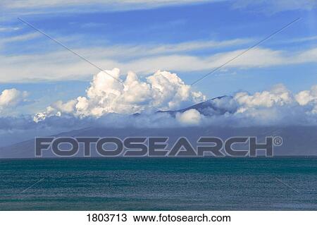 Stock Image - Clouds over Molokai, Hawaii, USA . Fotosearch