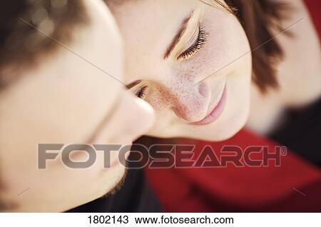 Couple with their heads together View Large Photo Image Stock Image - Couple with their heads together. Fotosearch