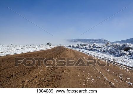 Stock Photo - Dirt road in winter. Fotosearch