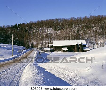 Stock Image - Empty road with cottage and trees on hill. Fotosearch