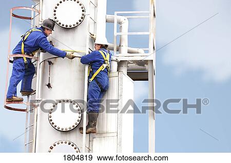 Stock Photo - Engineers working on a plant. Fotosearch