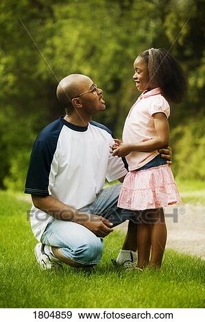 Father speaking with daughter View Large Photo Image Stock Photo - Father speaking with daughter. Fotosearch