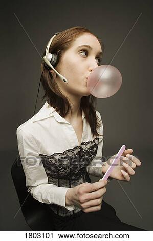 Stock Image - Female disinterested with work. Fotosearch