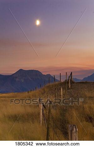 Fence and early evening moonrise, Waterton Lakes National Park, Alberta View Large Photo Image Stock Image - Fence and early evening moonrise, Waterton Lakes National Park, Alberta . Fotosearch