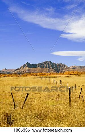 Fence line and mountain in the fall View Large Photo Image Stock Photography - Fence line and mountain in the fall. Fotosearch