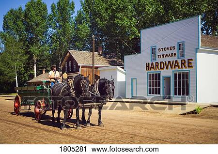 Fort Edmonton Park, horse team and wagon pass historic hardware store View Large Photo Image Stock Image - Fort Edmonton Park, horse team and wagon pass historic hardware store . Fotosearch