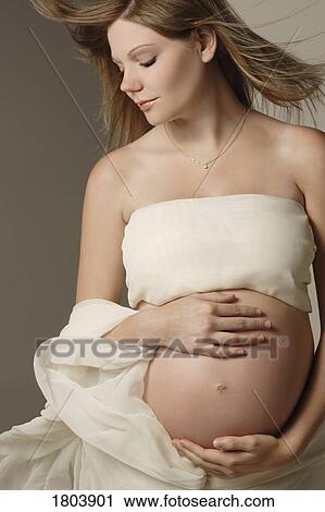 Front view of a pregnant woman View Large Photo Image Stock Image - Front view of a pregnant woman. Fotosearch