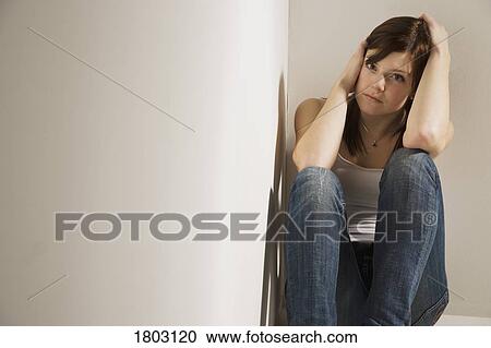 Girl huddled in corner View Large Photo Image Stock Image - Girl huddled in corner. Fotosearch